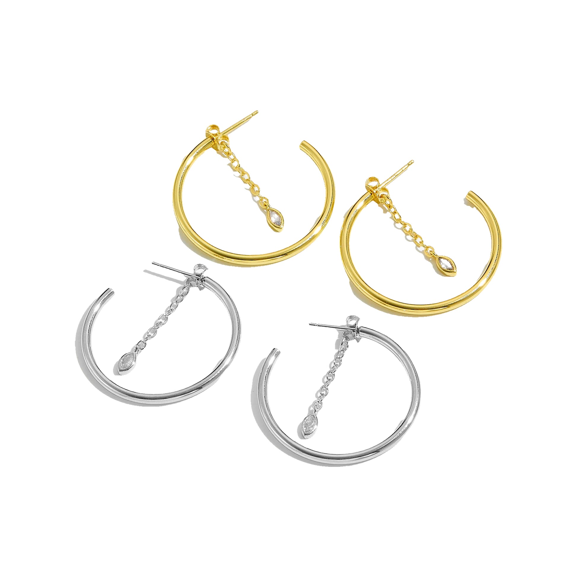 Two gold-tone and two silver-tone 25 mm hoops with marquise chain dangles on white background