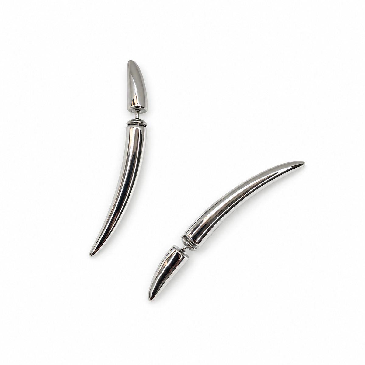 Silver-tone sculpted crescent earrings on white background